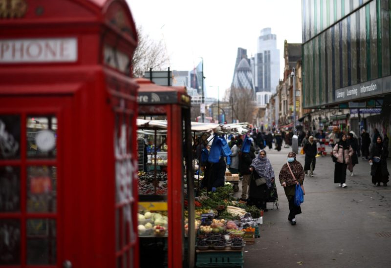 People browse stalls at a street market in east London, Britain, February 4, 2023. REUTERS/Henry Nicholls