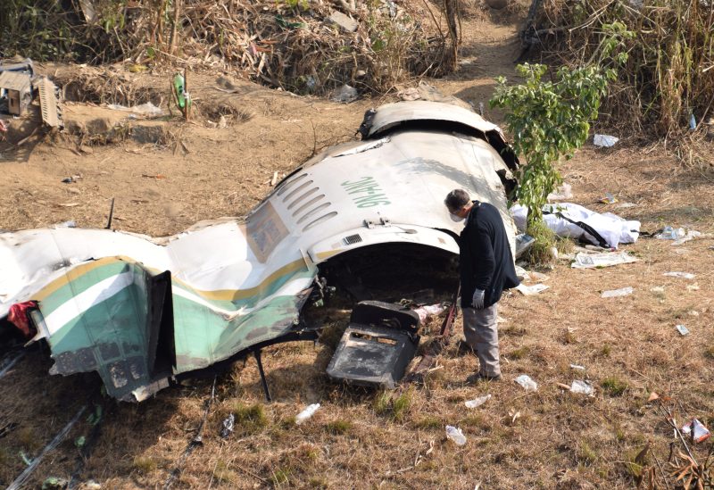 A member of French investigating team investigates the wreckage of a Yeti Airlines operated aircraft, in Pokhara, Nepal January 18, 2023. REUTERS/Krishna Mani Baral/File Photo