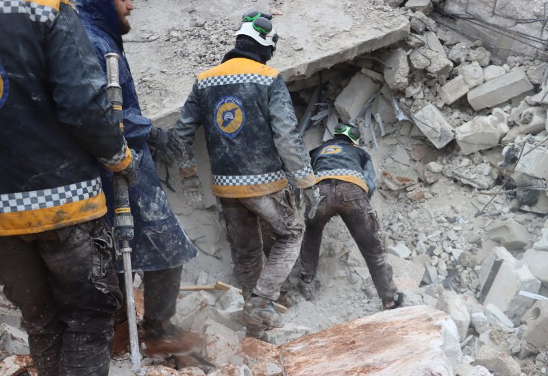 Rescuers search for survivors under the rubble, following an earthquake, in Al Atarib, Syria February 6, 2023 in this picture obtained from social media. White Helmets/via REUTERS