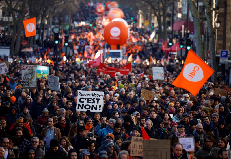 A general view shows protesters during a demonstration against French government's pension reform plan in Paris as part of the third day of national strike and protests in France, February 7, 2023. The slogan reads "Macron's pensions reform, it's no". REUTERS/Sarah Meyssonnier