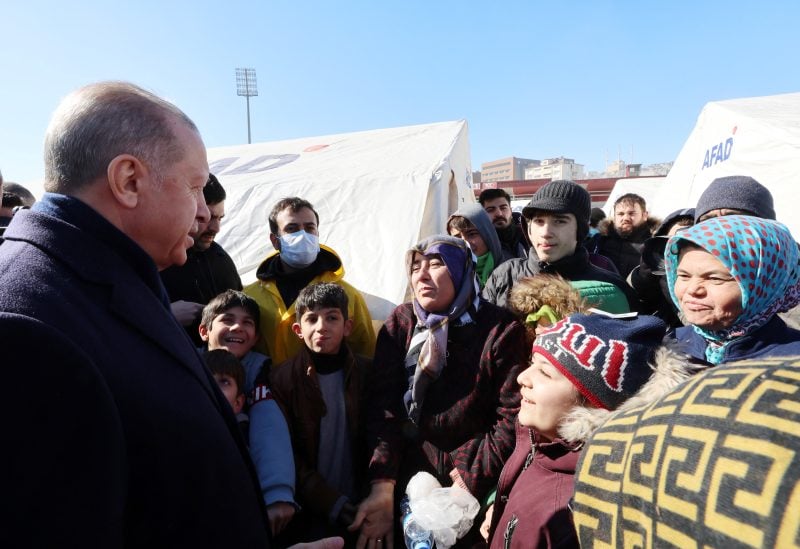 Turkish President Tayyip Erdogan meets with people in the aftermath of a deadly earthquake in Kahramanmaras, Turkey February 8, 2023. Murat Cetinmuhurdar/Presidential Press Office/Handout via REUTERS