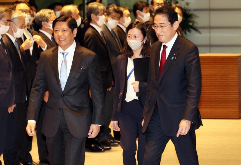 Philippine President Ferdinand Marcos Jr. (L) walks with Japanese Prime Minister Fumio Kishida at the welcoming ceremony at the prime minister's official residence in Tokyo, Japan on February 9, 2023. Yoshikazu Tsuno/Pool via REUTERS