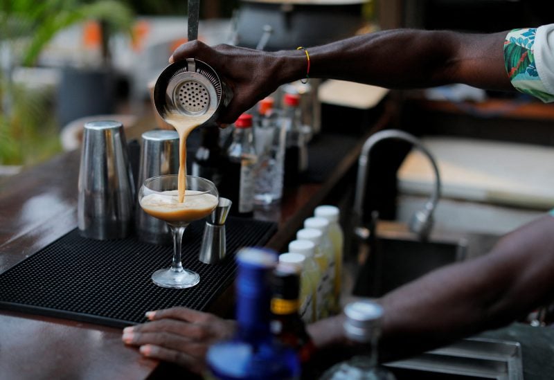A mixologist prepares a glass of espresso martini at a bar in Accra, Ghana, February 21, 2023. REUTERS/Francis Kokoroko