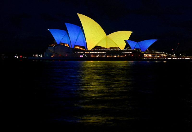 The sails of the Sydney Opera House get illuminated with the colours of the Ukrainian Flag to mark one year since Russia's invasion of Ukraine began, in Sydney, Australia, February 24, 2023. REUTERS Jaimi Joy