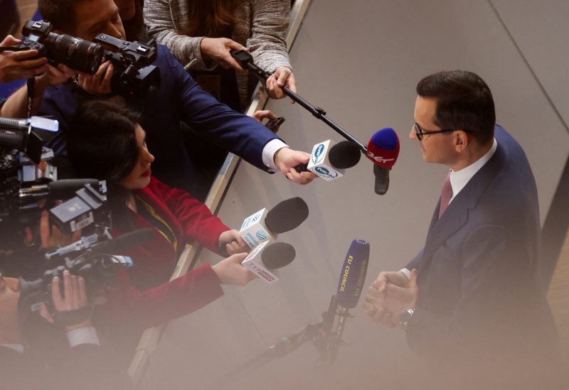 Poland's Prime Minister Mateusz Morawiecki speaks to the media as he attends European leaders summit in Brussels, Belgium February 9, 2023. REUTERS/Johanna Geron