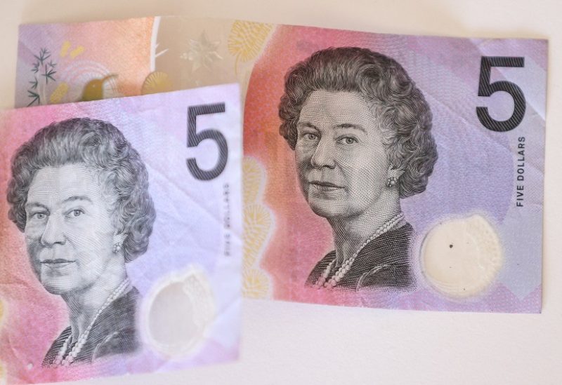 Australian $5 banknotes with a portrait of the late Queen Elizabeth II are seen in this picture illustration taken February 2, 2023. REUTERS/Loren Elliott/Illustration