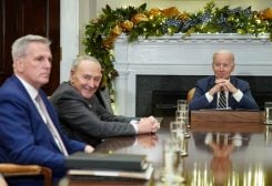 FILE PHOTO: U.S. President Joe Biden looks toward House Republican leader Kevin McCarthy and Senate Majority Leader Chuck Schumer, during a meeting with congressional leaders at the White House in Washington, U.S., November 29, 2022. REUTERS/Kevin Lamarque/File Photo