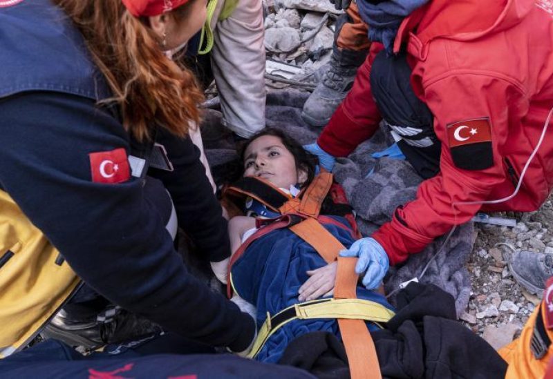 Rescue workers and medics pull out a person from a collapsed building in Antakya, Türkiye, Wednesday, Feb. 15, 2023. More than 35,000 people have died in Türkiye as a result of last week's earthquake, making it the deadliest such disaster since the country's founding 100 years ago. (Ugur Yildirim/DIA via AP)