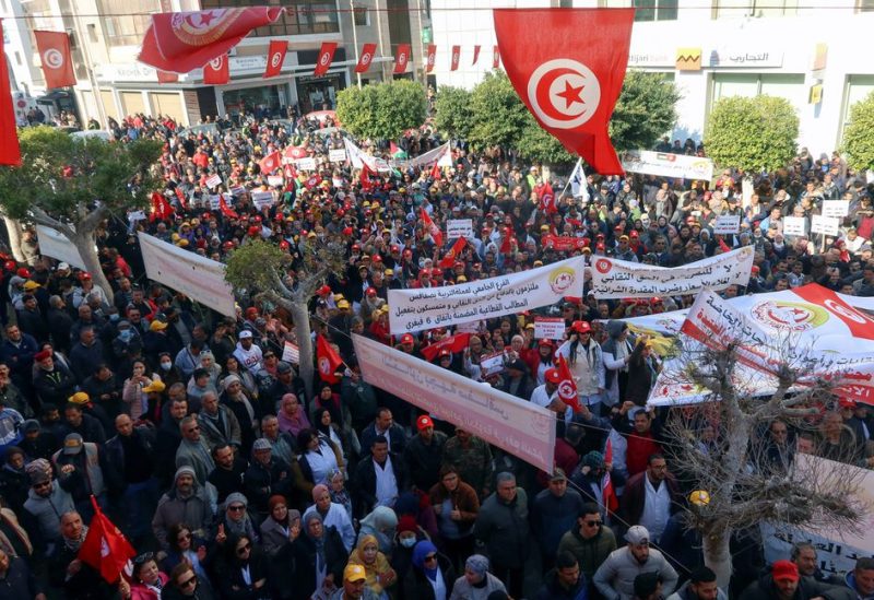 Supporters of the Tunisian General Labour Union (UGTT), carry flags and banners during a protest against what they say authority's attacks on freedoms and union rights, in Sfax, Tunisia February 18, 2023 - REUTERS