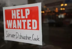 A ?Help Wanted? sign hangs in restaurant window in Medford, Massachusetts, U.S., January 25, 2023. REUTERS