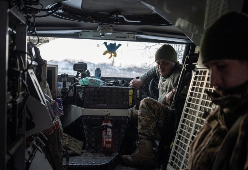 Ukrainian servicemen of the 80th Air Assault Brigade sit inside a Bushmaster Protected Mobility Vehicle, amid Russia's attack on Ukraine, near Bahmut, Donetsk region, Ukraine, February 16, 2023 - REUTERS