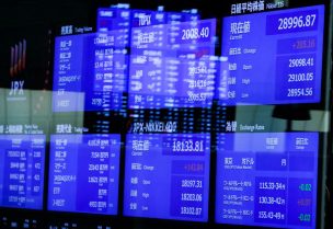 Monitors displaying the stock index prices and Japanese yen exchange rate against the U.S. dollar are seen after the New Year ceremony marking the opening of trading in 2022 at the Tokyo Stock Exchange (TSE), amid the coronavirus disease (COVID-19) pandemic, in Tokyo, Japan January 4, 2022 - REUTERS