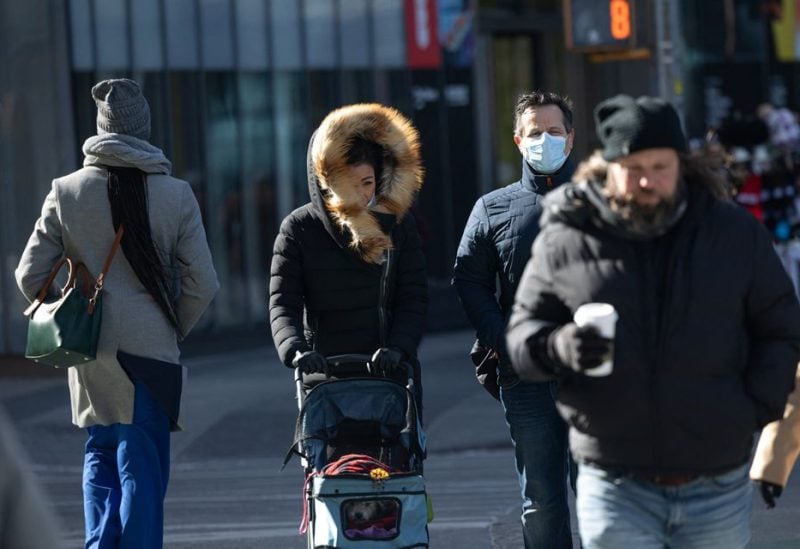 People bundle up in bitterly cold temperatures and high winds in Manhattan as deep cold spread across the northeast United States, in New York City, New York, U.S., February 3, 2023 - REUTERS