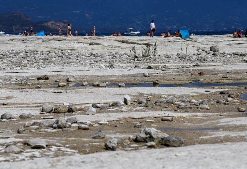 Underwater rocks emerge from the water of Lake Garda after northern Italy experienced the worst drought in 70 years in Sirmione, Italy, August 16, 2022. REUTERS