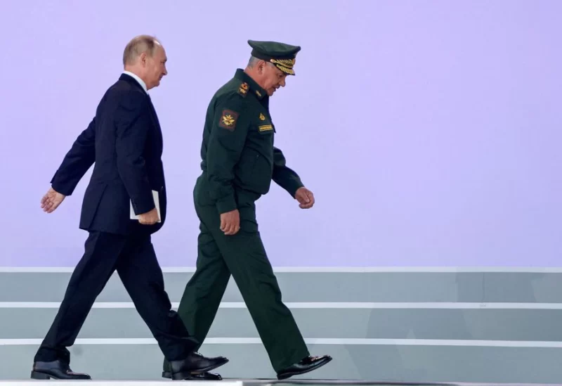 Russian President Vladimir Putin and Defense Minister Sergei Shoigu attend a ceremony opening the international military-technical forum Army-2022 - REUTERS