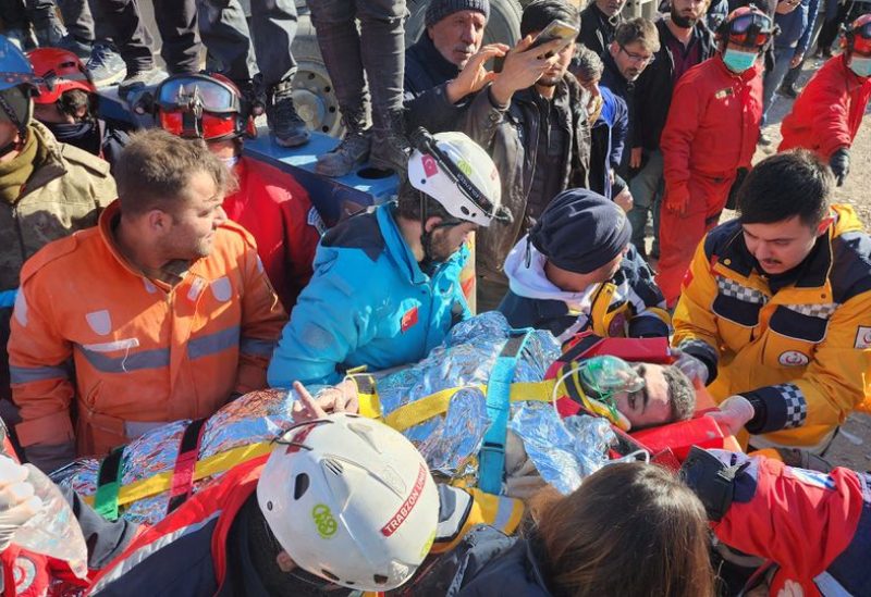 Muhammed Cafer Cetin, a 18-year-old earthquake survivor, is rescued from the rubble of a building some 198 hours after last week's devastating earthquake, in Adiyaman, Turkey February 14, 2023 - REUTERS