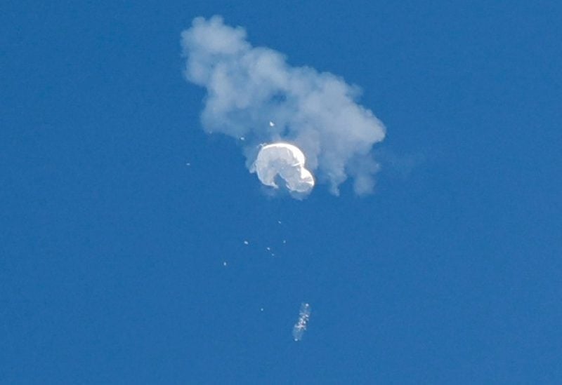 The suspected Chinese spy balloon drifts to the ocean after being shot down off the coast in Surfside Beach, South Carolina, U.S. February 4, 2023. REUTERS/Randall Hill