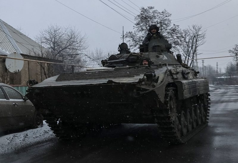 Ukrainian service members ride a BMP-2 infantry fighting vehicle, as Russia's attack on Ukraine continues, near the frontline town of Bakhmut, Donetsk region, Ukraine February 6, 2023. REUTERS/Yevhen Titov