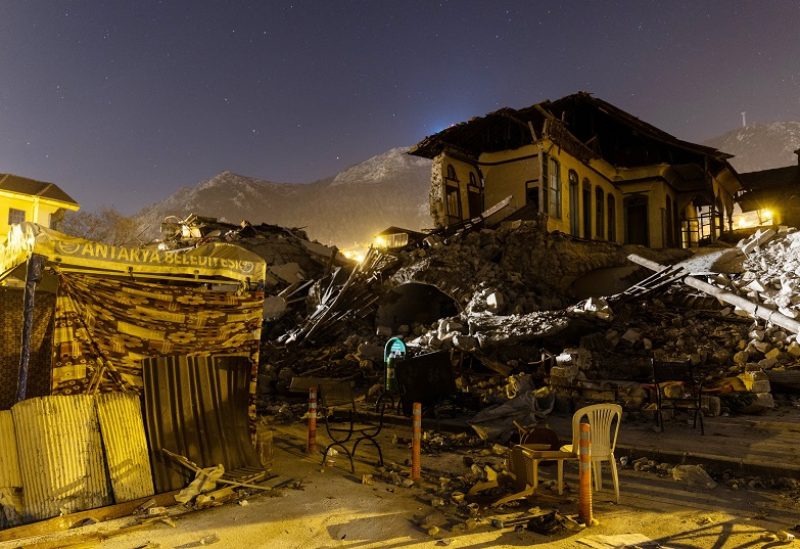 Destroyed buildings are seen at night in the aftermath of a deadly earthquake in Antakya, Turkey February 19, 2023. REUTERS/Maxim Shemetov