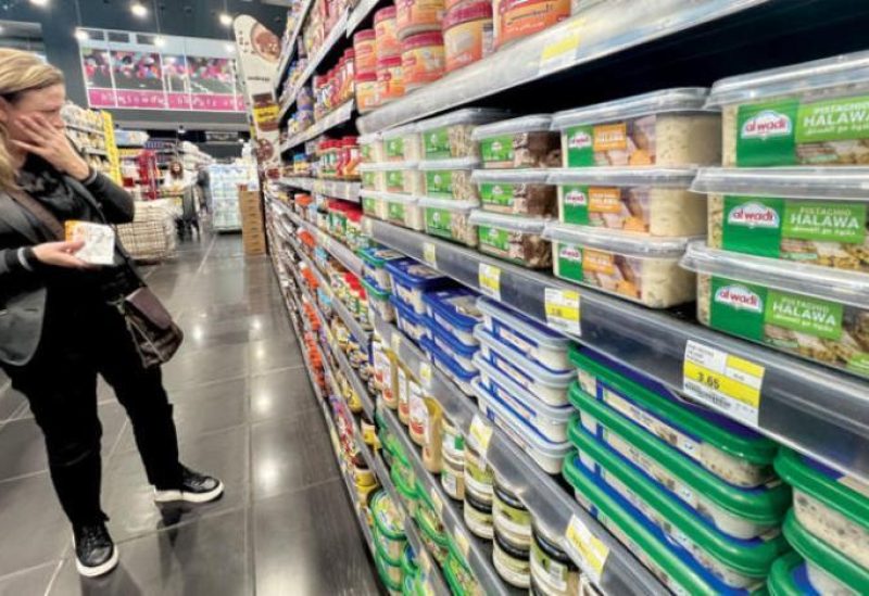 A Lebanese woman looks at merchandise priced in US dollars in a major supermarket in Beirut. (AP)