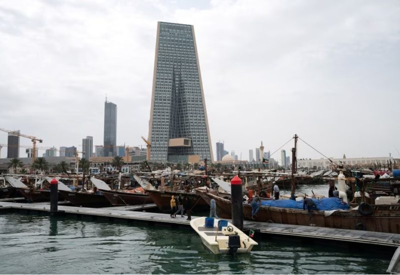 The Kuwait Central Bank towers over the traditional Dhow harbor in Kuwait City, Kuwait March 18, 2020. REUTERS/Stephanie McGehee