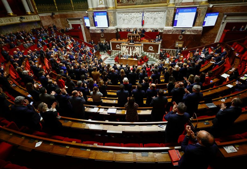 Members of parliament clap as French Prime Minister Elisabeth Borne speaks during a debate on the pension reform plan at the National Assembly in Paris, France February 17, 2023. REUTERS/Sarah Meyssonnier
