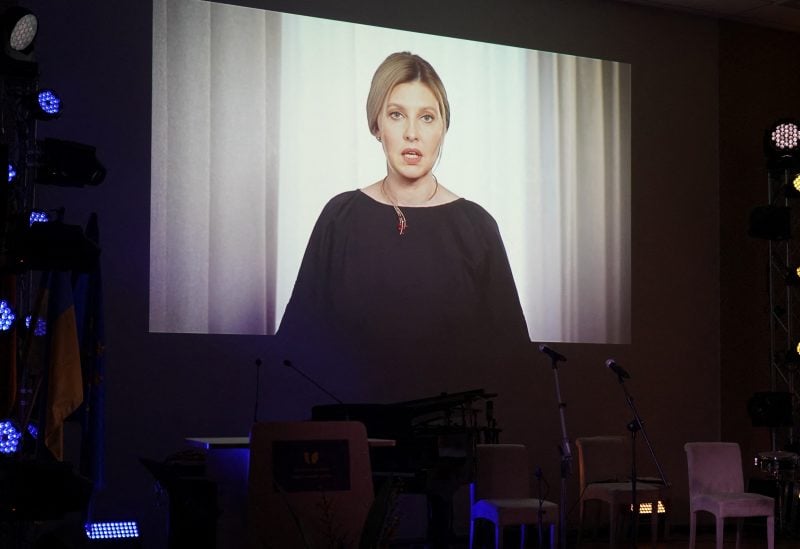 A TV screen shows Ukraine's first lady Olena Zelenska during an event marking the one year anniversary of Russia's invasion of Ukraine, at a Ukrainian refugee shelter in Vilnius, Lithuania February 23, 2023. REUTERS