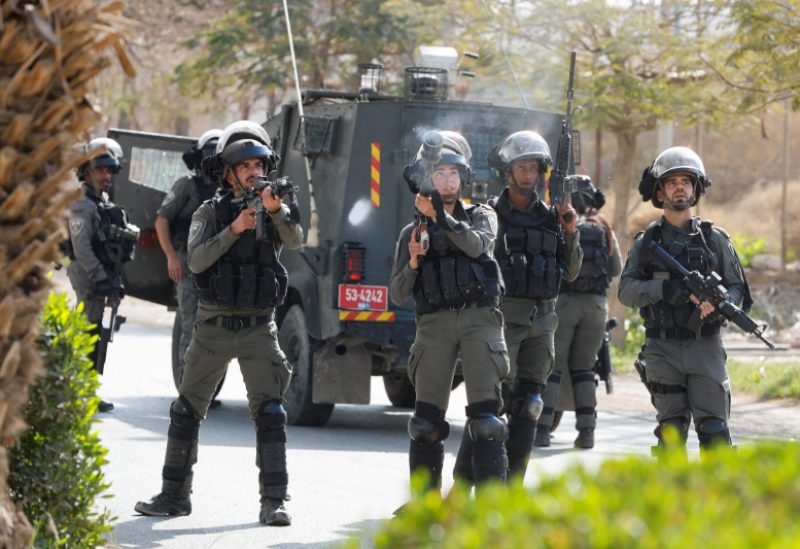 Israeli troops aim their weapons as they clash with Palestinians during a raid in Jericho in the Israeli-occupied West Bank, March 1, 2023. REUTERS/Ammar Awad