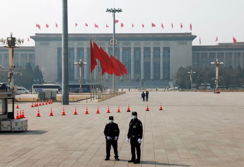 Security personnel keep watch on the Tiananmen Square before the opening session of the Chinese People's Political Consultative Conference (CPPCC) at the Great Hall of the People in Beijing, China March 4, 2023. REUTERS/Thomas Peter