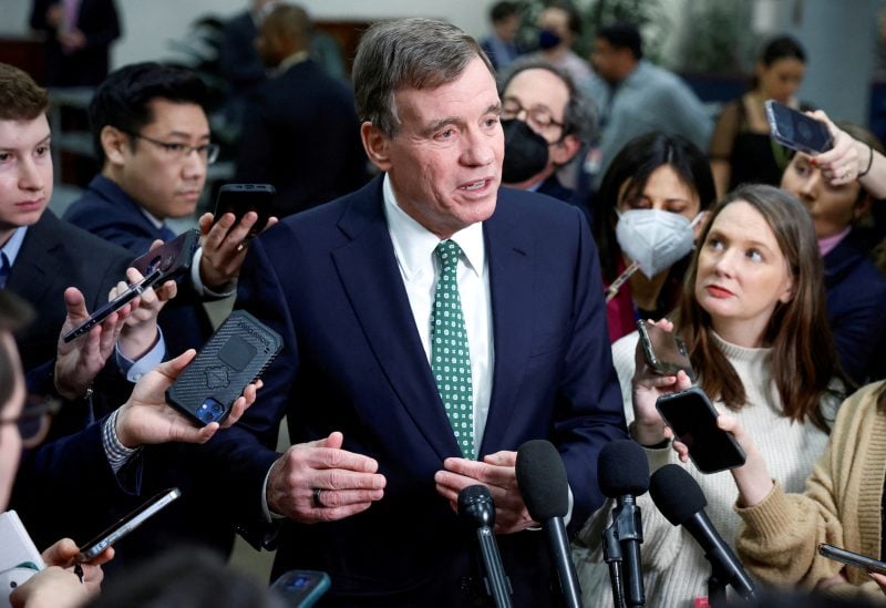 U.S. Senator Mark Warner (D-VA) speaks to the media following a classified briefing for U.S. Senators about the latest unknown objects shot down by the U.S. military, on Capitol Hill in Washington, U.S., February 14, 2023. REUTERS/Evelyn Hockstein/File Photo