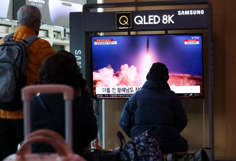 People watch a TV broadcasting a news report on North Korea firing a ballistic missile into the sea off its east coast, at a railway station in Seoul, South Korea, March 16, 2023. REUTERS/Kim Hong-Ji