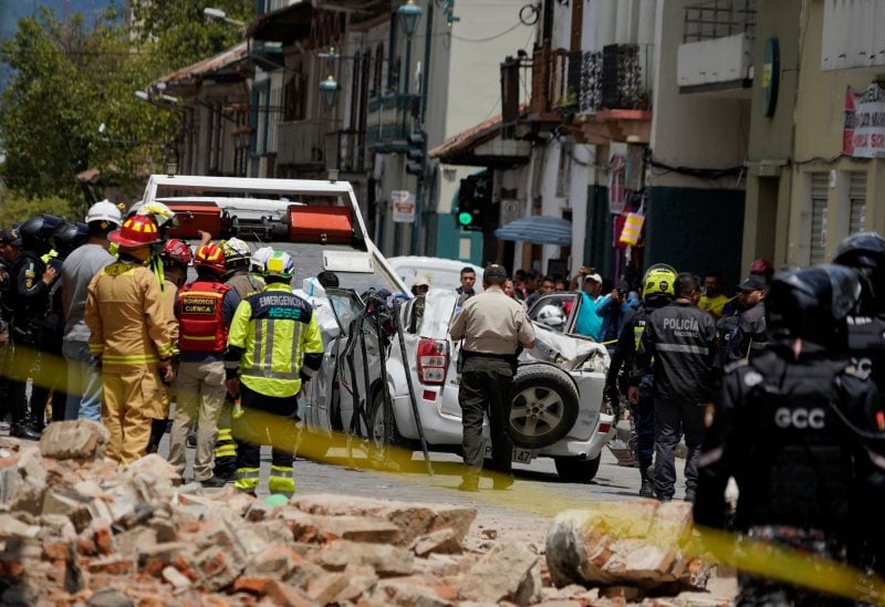 A damaged car and rubble from a house affected by the earthquake are pictured in Cuenca, Ecuador. March 18, 2023. REUTERS/Rafa Idrovo Espinoza