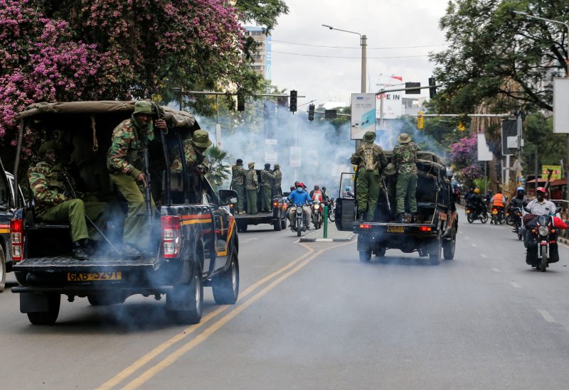 Riot police officers disperse supporters of Kenyan opposition leader Raila Odinga of the Azimio La Umoja (Declaration of Unity) One Kenya Alliance, during a nationwide protest over cost of living and President William Ruto's government in downtown Nairobi, Kenya March 20, 2023. REUTERS/Thomas Mukoya