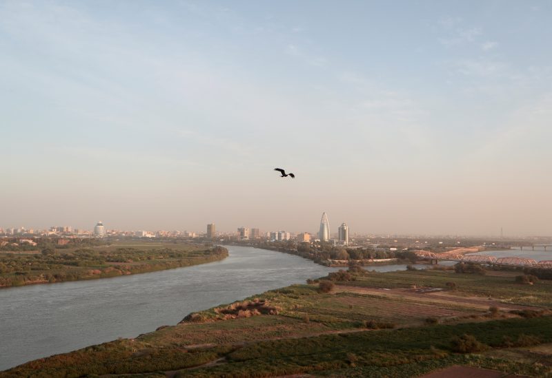 A bird flies over the convergence between the White Nile river and Blue Nile river in Khartoum, Sudan, February 17, 2020. REUTERS/Zohra Bensemra/File Photo