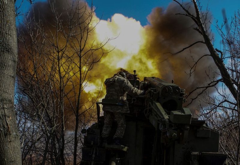 Ukrainian servicemen fire a 2S5 Giatsint-S self-propelled howitzer towards Russian troops outside the frontline town of Bakhmut, amid Russia's attack on Ukraine, in Donetsk region, Ukraine March 5, 2023 - REUTERS