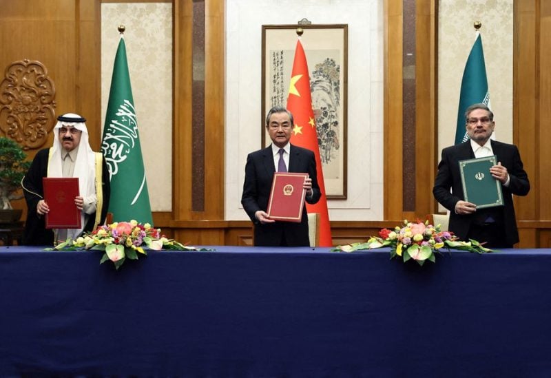 Wang Yi, a member of the Political Bureau of the Communist Party of China (CPC) Central Committee and director of the Office of the Central Foreign Affairs Commission attends a meeting with Secretary of Iran's Supreme National Security Council Ali Shamkhani and Minister of State and national security adviser of Saudi Arabia Musaad bin Mohammed Al Aiban in Beijing, China March 10, 2023. China Daily via REUTERS