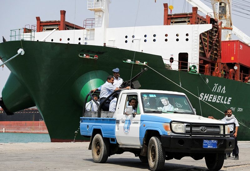 Coastguard soldiers patrol the vicinity of a commercial ship unloading containers in the Houthi-held Red Sea port of Hodeidah, as a container ship carrying general commercial goods docked at the port for the first time since at least 2016, in Hodeidah, Yemen February 25, 2023. REUTERS/Khaled Abdullah