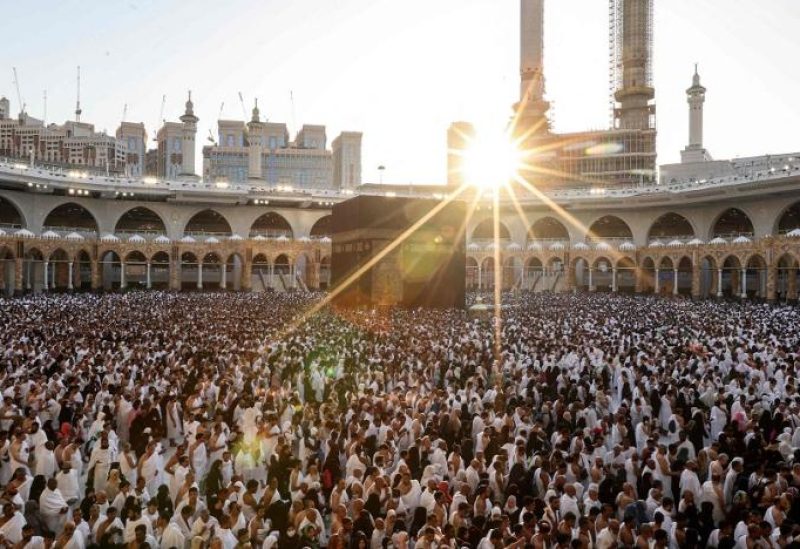 Muslim worshippers gather before the Kaaba, as they perform the Maghrib (sunset) prayer to mark the end of the first day of fasting in the holy month of Ramadan, at the Grand Mosque in the holy city of Makkah on March 23, 2023. (AFP)