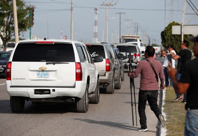 Vehicles pass by as they carry the bodies of Americans kidnapped by gunmen to the U.S. border, in Matamoros, Mexico, March 9, 2023. REUTERS