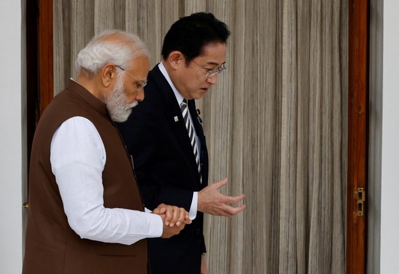 Indian Prime Minister Narendra Modi and Japan Prime Minister Fumio Kishida talk before their meeting at the Hyderabad House in New Delhi, India, March 20, 2023. REUTERS/Adnan Abidi