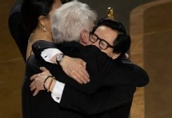 Ke Huy Quan hugs Harrison Ford after receiving the Oscar for Best Picture for "Everything Everywhere All at Once" during the Oscars show at the 95th Academy Awards in Hollywood, Los Angeles, California, U.S., March 12, 2023. REUTERS/Carlos Barria