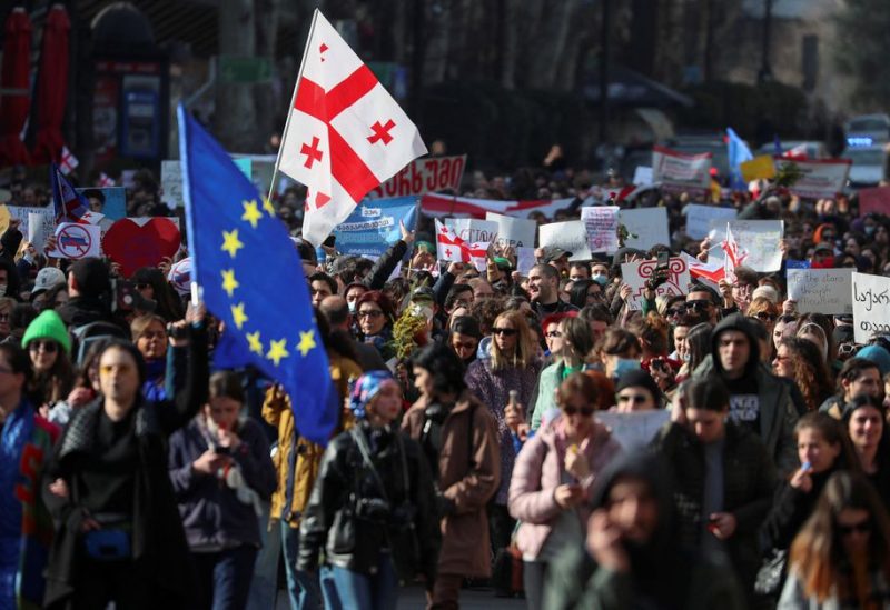 Participants march during a protest against a draft law on "foreign agents", which critics say represents an authoritarian shift and could hurt Georgia's bid to join the European Union, in Tbilisi, Georgia, March 8, 2023 - REUTERS