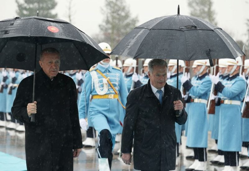 Turkey's President Tayyip Erdogan and Finland?s President Sauli Niinisto review a guard of honour during a welcoming ceremony in Ankara, Turkey March 17, 2023 - REUTERS