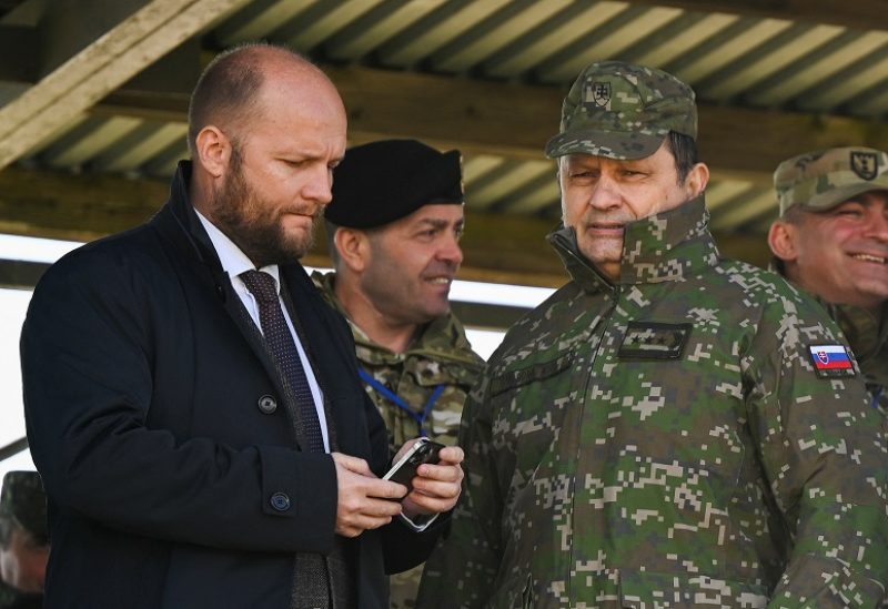 Ministry of Defence of the Slovak Republic Jaroslav Nad and General Lubomir Svoboda attend a drill during the NATO multinational battle group military exercise Slovak Shields 2023 at a military training area in Lest, near the town of Zvolen, Slovakia, March 21, 2023. REUTERS/Radovan Stoklasa