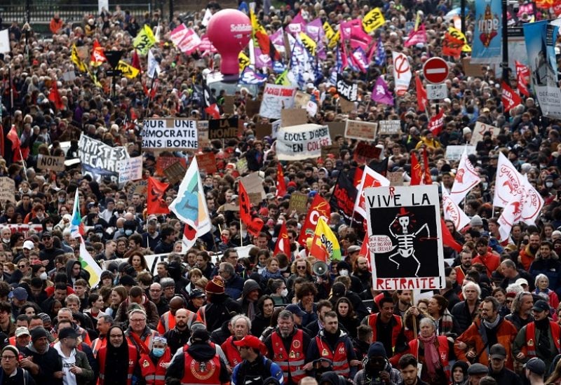 Protesters attend a demonstration during the ninth day of nationwide strikes and protests against French government's pension reform, in Nantes, France, March 23, 2023. The slogan showing the drawing of a skeleton reads "long live retirement". REUTERS/Stephane Mahe