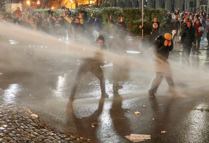 Police use a water cannon to disperse protesters during a rally against the "foreign agents" law in Tbilisi, Georgia, March 7, 2023. REUTERS