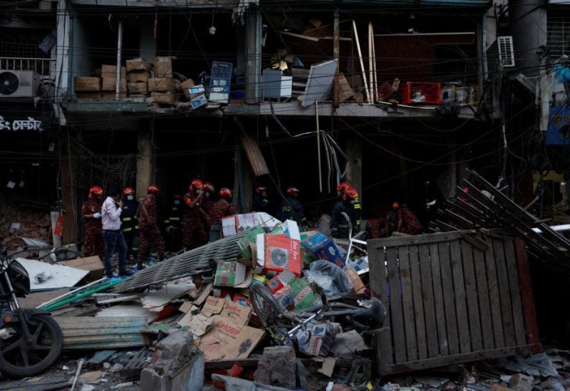Firefighters and rescue workers are seen on the site of an explosion in a multi storey building in Dhaka, Bangladesh, March 7, 2023. REUTERS