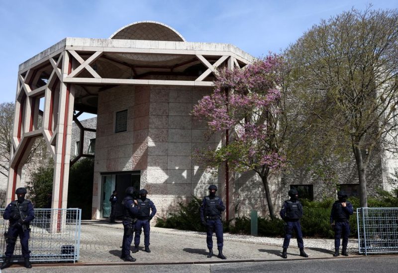 Police officers stand guard outside Ismaili Centre, after a deadly knife attack in Lisbon, Portugal, March 28, 2023. REUTERS