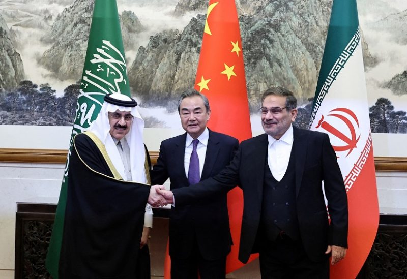 FILE PHOTO: Wang Yi, a member of the Political Bureau of the Communist Party of China (CPC) Central Committee and director of the Office of the Central Foreign Affairs Commission, Ali Shamkhani, the secretary of Iran’s Supreme National Security Council, and Minister of State and national security adviser of Saudi Arabia Musaad bin Mohammed Al Aiban pose for pictures during a meeting in Beijing, China March 10, 2023. China Daily via REUTERS ATTENTION EDITORS - THIS IMAGE WAS PROVIDED BY A THIRD PARTY. CHINA OUT./File Photo