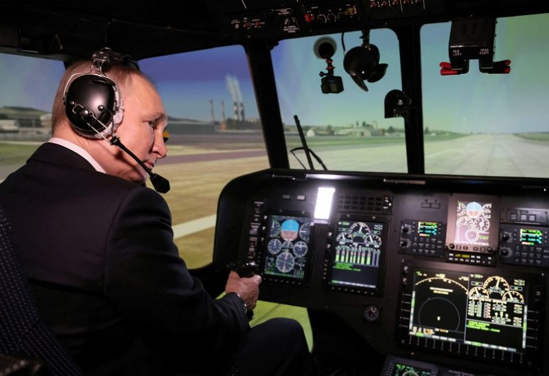 Russian President Vladimir Putin is seen inside a cabin of helicopter simulator training as he visits aviation plant in Ulan-Ude, Buryatia republic, Russia March 14, 2023. Sputnik/Mikhail Metzel/Pool via REUTERS ATTENTION EDITORS - THIS IMAGE WAS PROVIDED BY A THIRD PARTY.